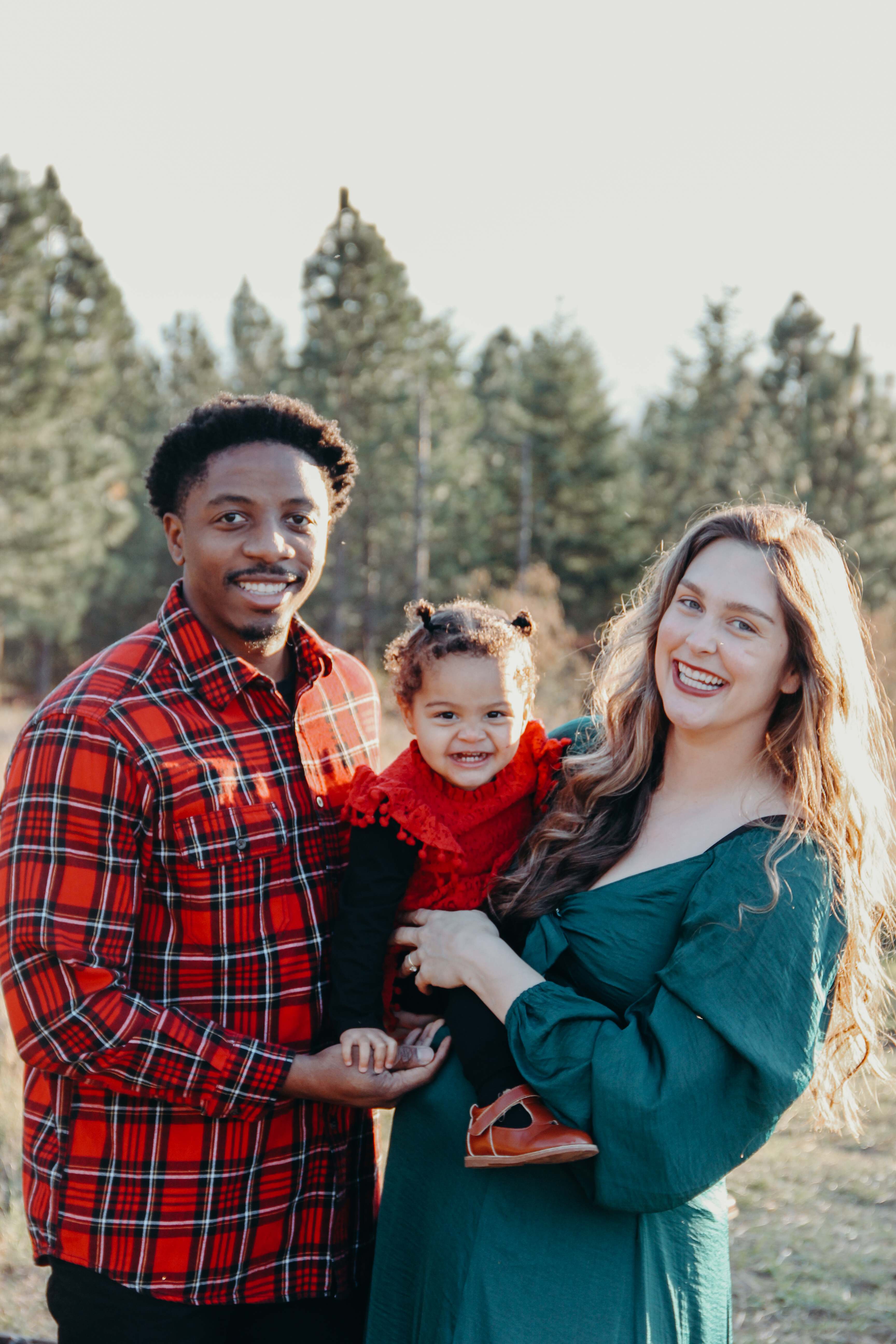 Family portrait outdoors with toddler